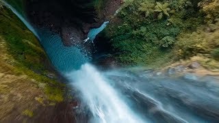 Drone Flies Through Jungle Waterfall [upl. by Anire]